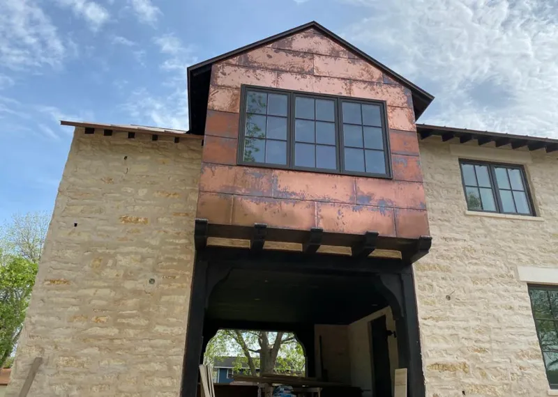 Copper metal panel facade on a stone building for Roof Repair in Eastern Goleta Valley
