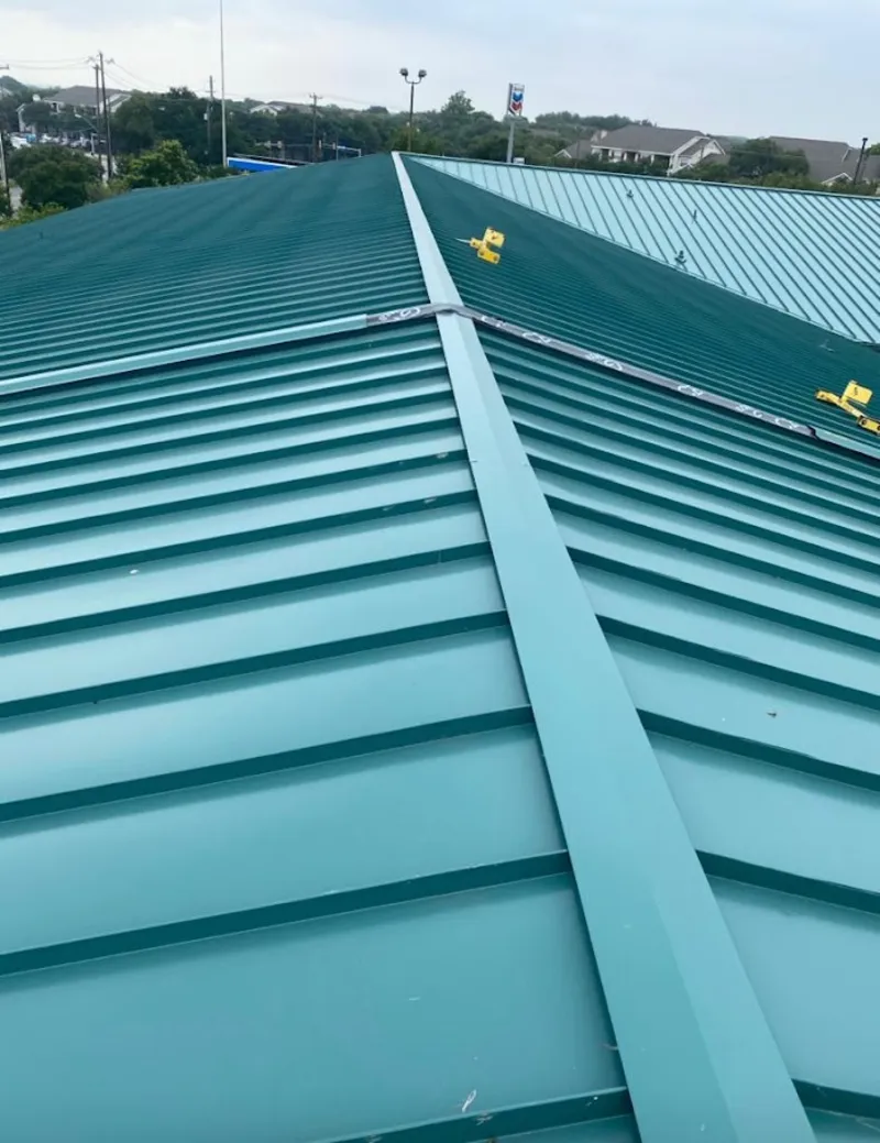 Green commercial metal roof ridge and valley for Metal Roof Repair in Eastern Goleta Valley