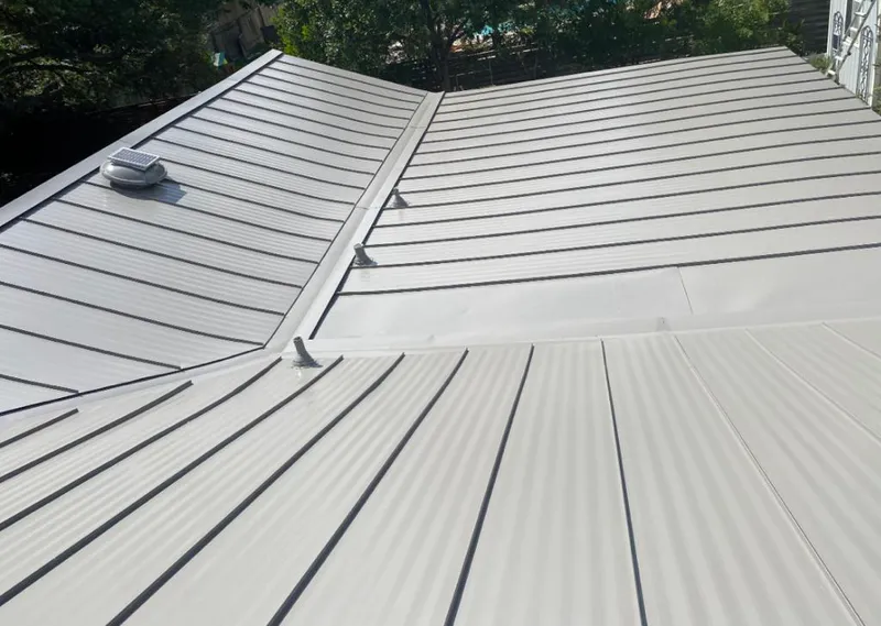 Solar attic fan installed on a metal roof for Roof Ventilation in Eastern Goleta Valley